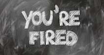 Svart skrivtavla med texten You're fired